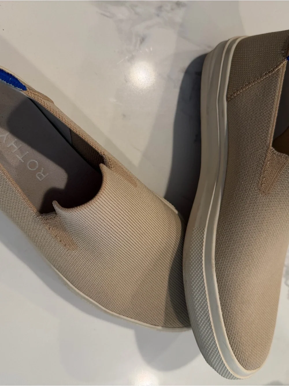 Rothy's Slip-On Flats in Tan with Blue Heel Accent
